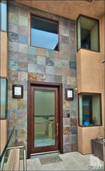 905 Mandalay Beach Road Oxnard, CA 93035 - Photo 7 of 30 a front view of a house with a garden