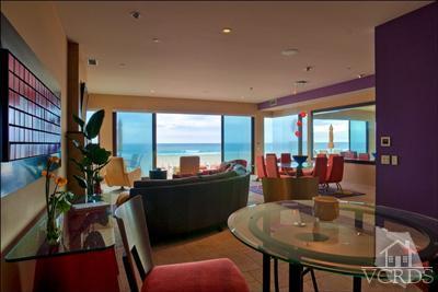 905 Mandalay Beach Road Oxnard, CA 93035 - Photo 9 of 30 a dining room with furniture a chandelier and a floor to ceiling window