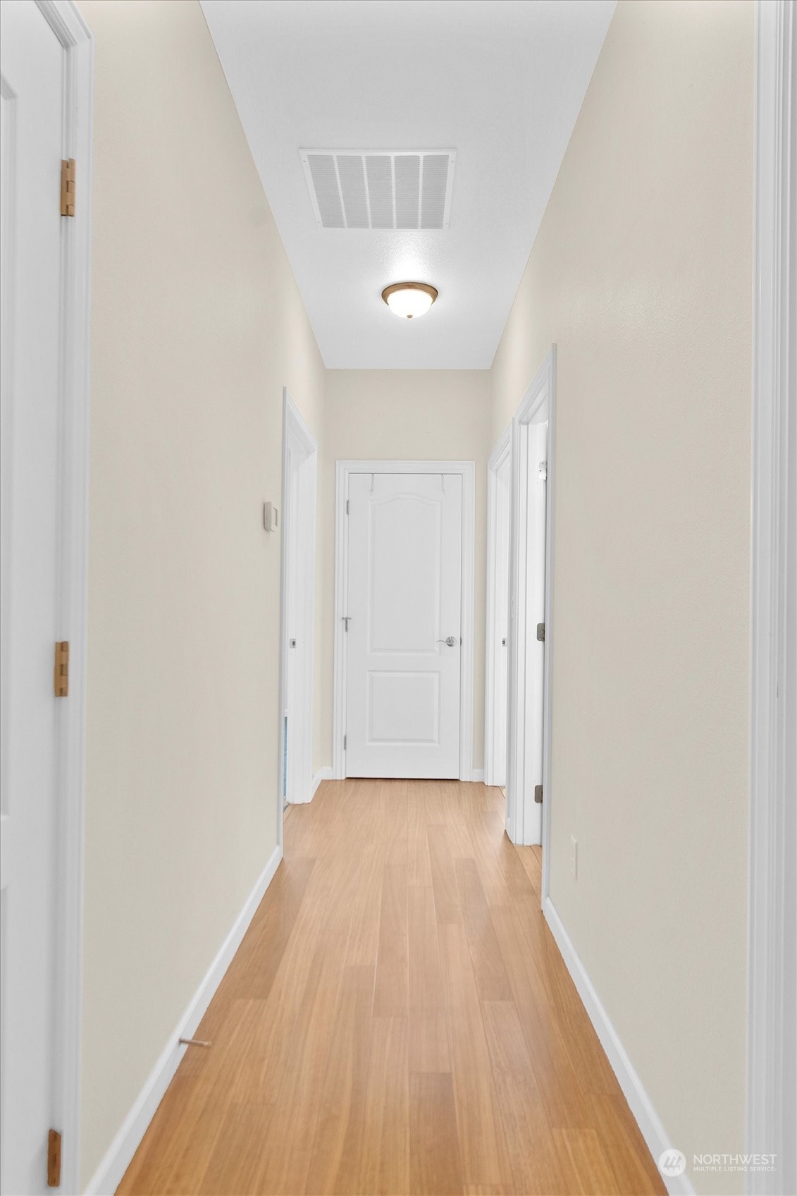 112 Willow Pointe Loop, Unit 112 Longview, WA 98632 - Photo 12 of 21 a view of a room with wooden floor and a ceiling fan