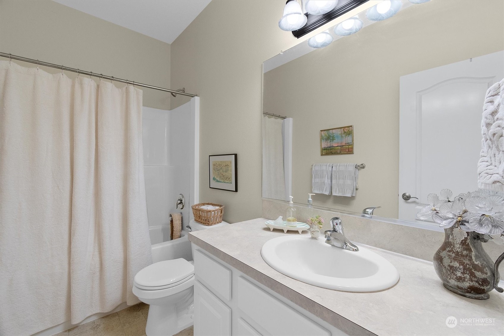 112 Willow Pointe Loop, Unit 112 Longview, WA 98632 - Photo 17 of 21 a bathroom with a sink toilet and shower