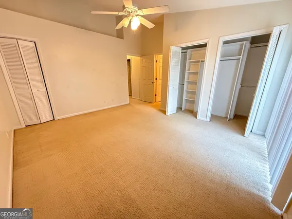 a view of an empty room with a fireplace