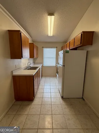 a bathroom with a sink a mirror and a bathtub