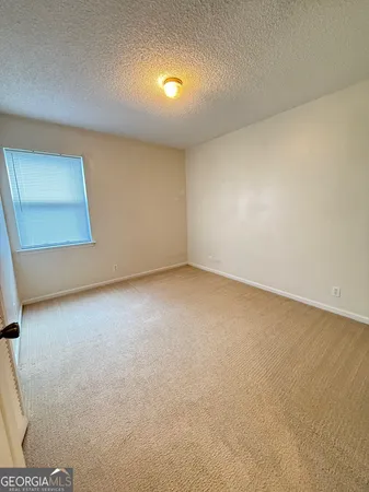 an empty room with a bench