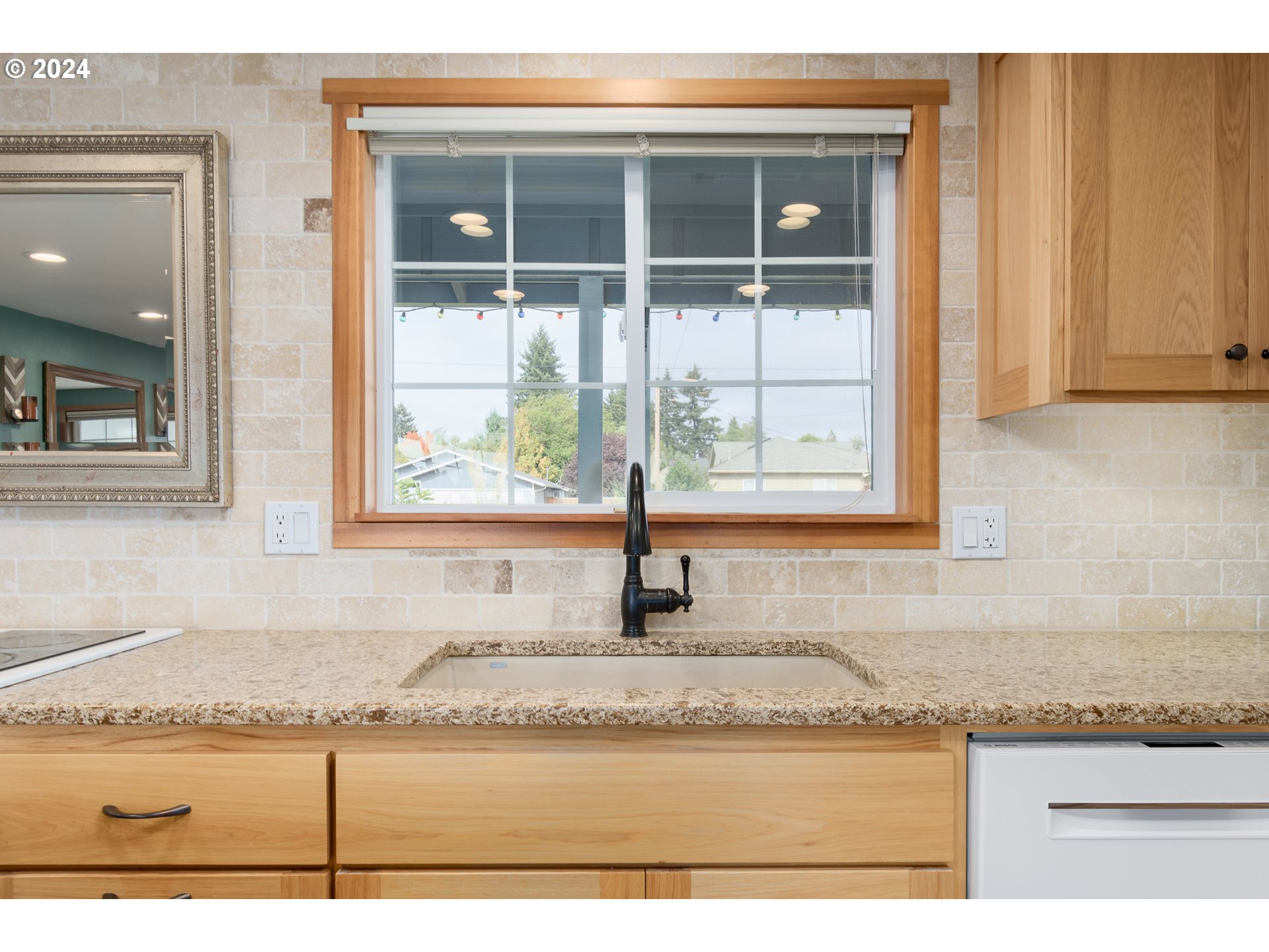 3456 Tempa Street Eugene, OR 97404 - Photo 12 of 48 a view of a kitchen that has a sink and a granite counter top