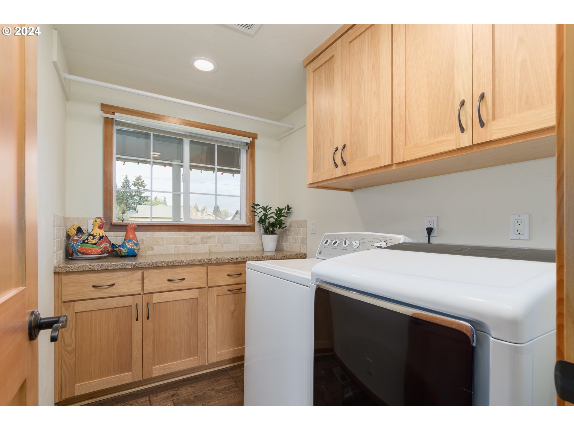 3456 Tempa Street Eugene, OR 97404 - Photo 17 of 48 a kitchen with white cabinets a sink and dishwasher