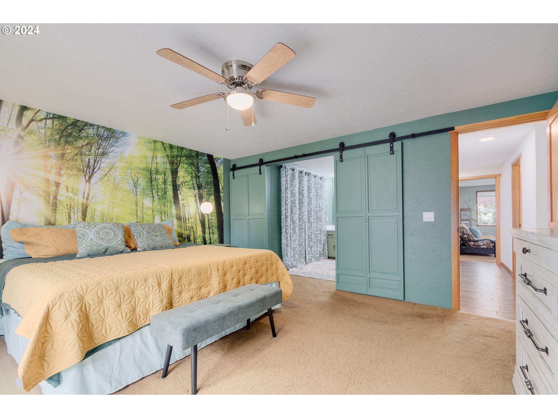 3456 Tempa Street Eugene, OR 97404 - Photo 25 of 48 a spacious bedroom with a bed and a chandelier