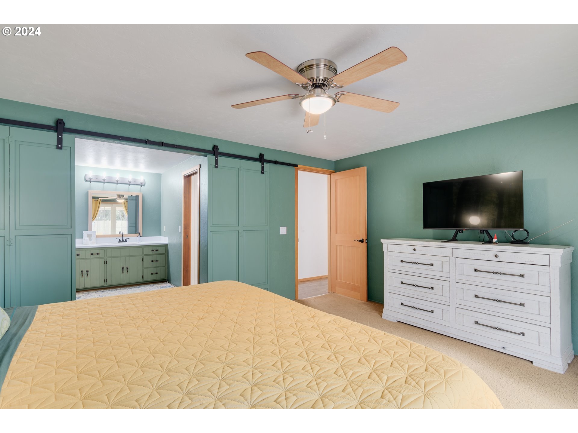 3456 Tempa Street Eugene, OR 97404 - Photo 26 of 48 a bedroom with a bed and a flat screen tv