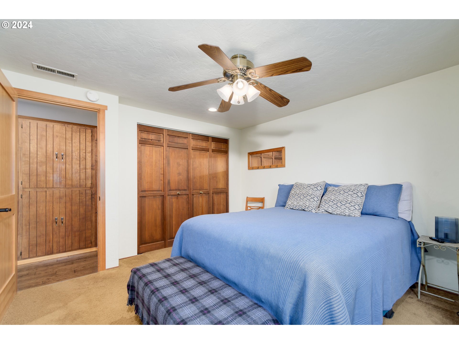 3456 Tempa Street Eugene, OR 97404 - Photo 32 of 48 a bedroom with a bed and a chandelier