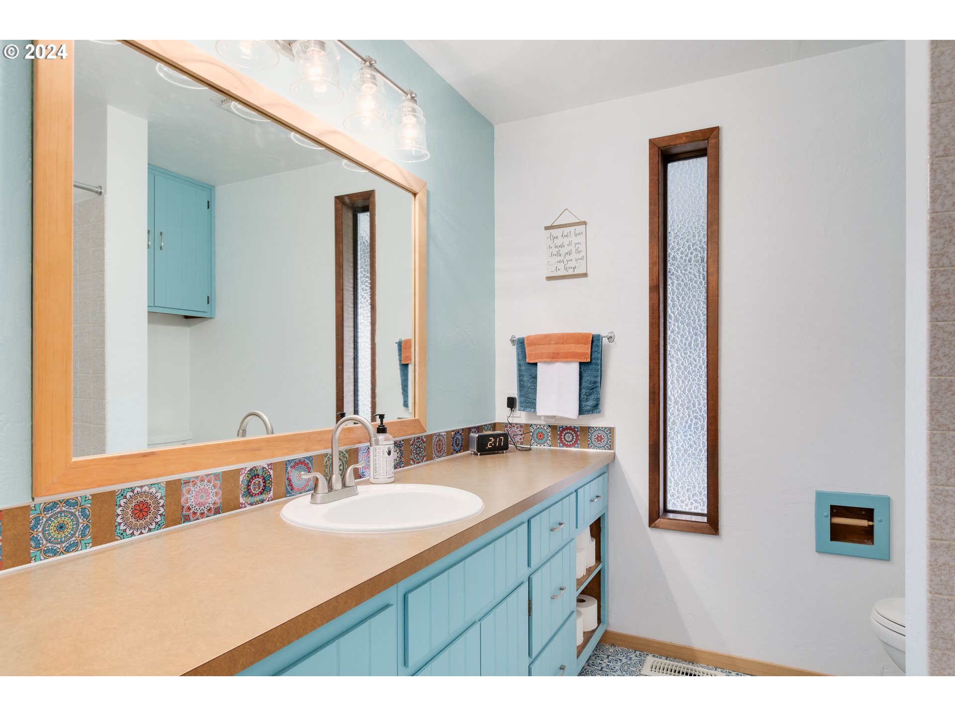3456 Tempa Street Eugene, OR 97404 - Photo 33 of 48 a bathroom with a sink double vanity granite and a mirror