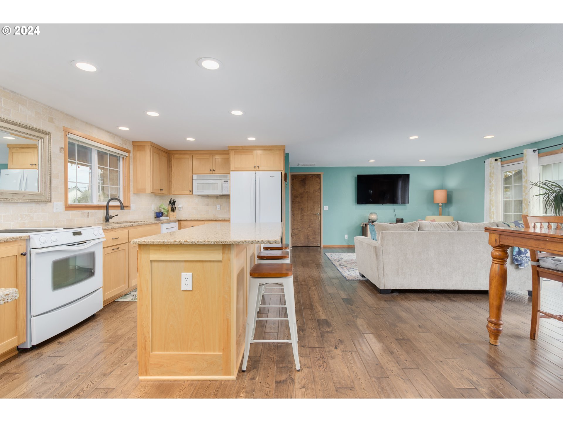 3456 Tempa Street Eugene, OR 97404 - Photo 8 of 48 a kitchen with a sink stainless steel appliances and white cabinets