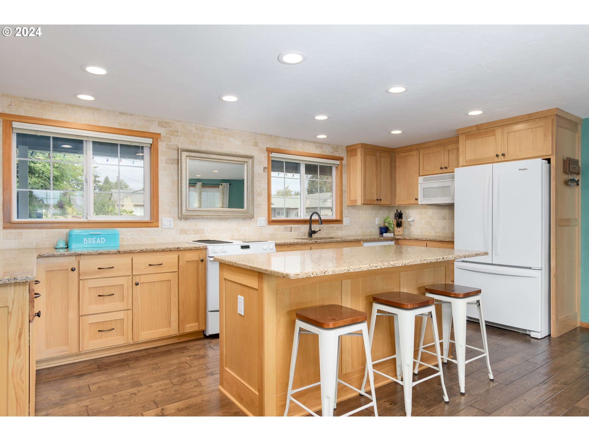 3456 Tempa Street Eugene, OR 97404 - Photo 9 of 48 a kitchen with white cabinets and white appliances