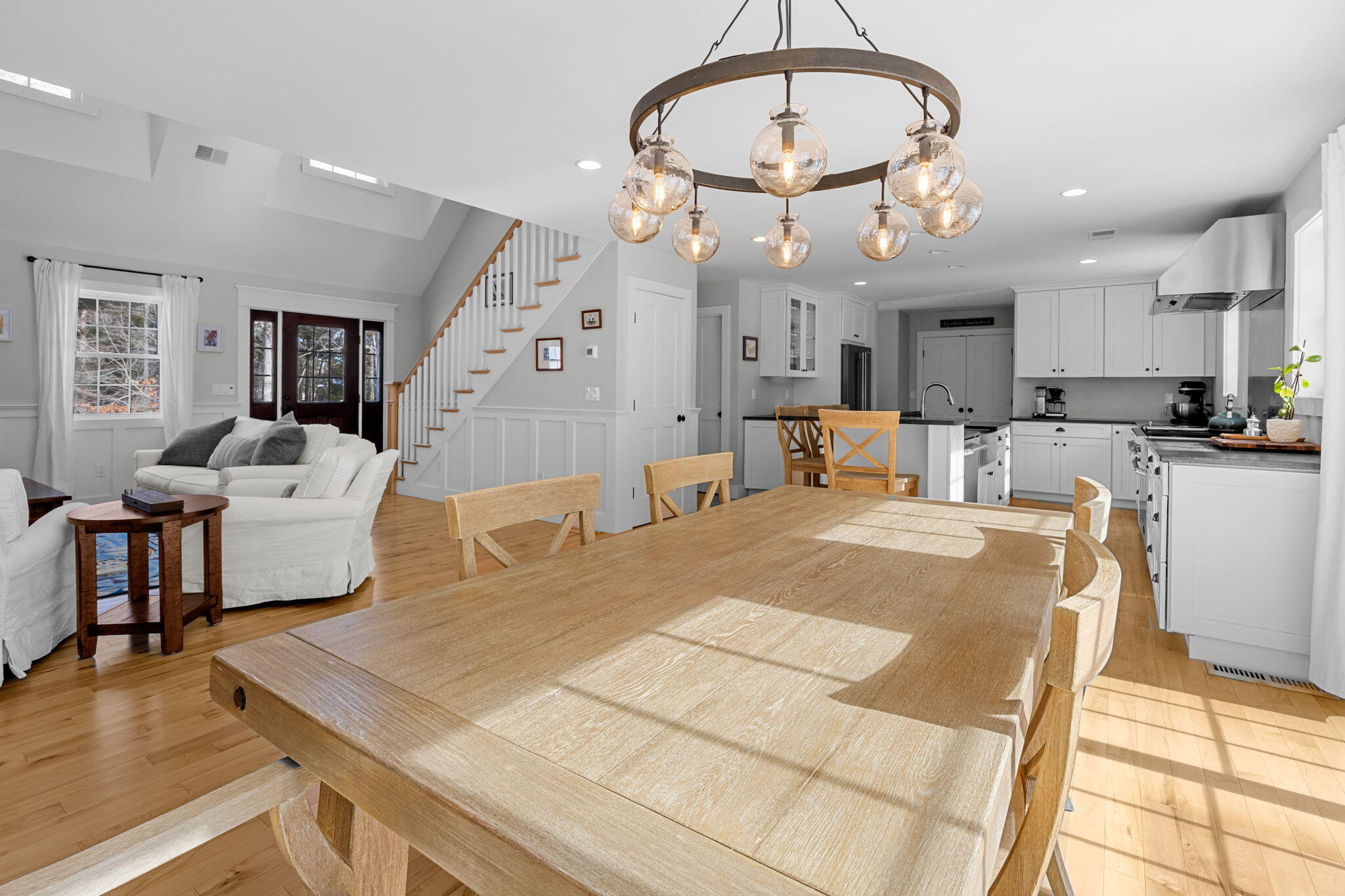 174 Cross Neck Road Marion, MA 02738 - Photo 8 of 41 a very nice looking dining room with kitchen island furniture a chandelier and a view of kitchen