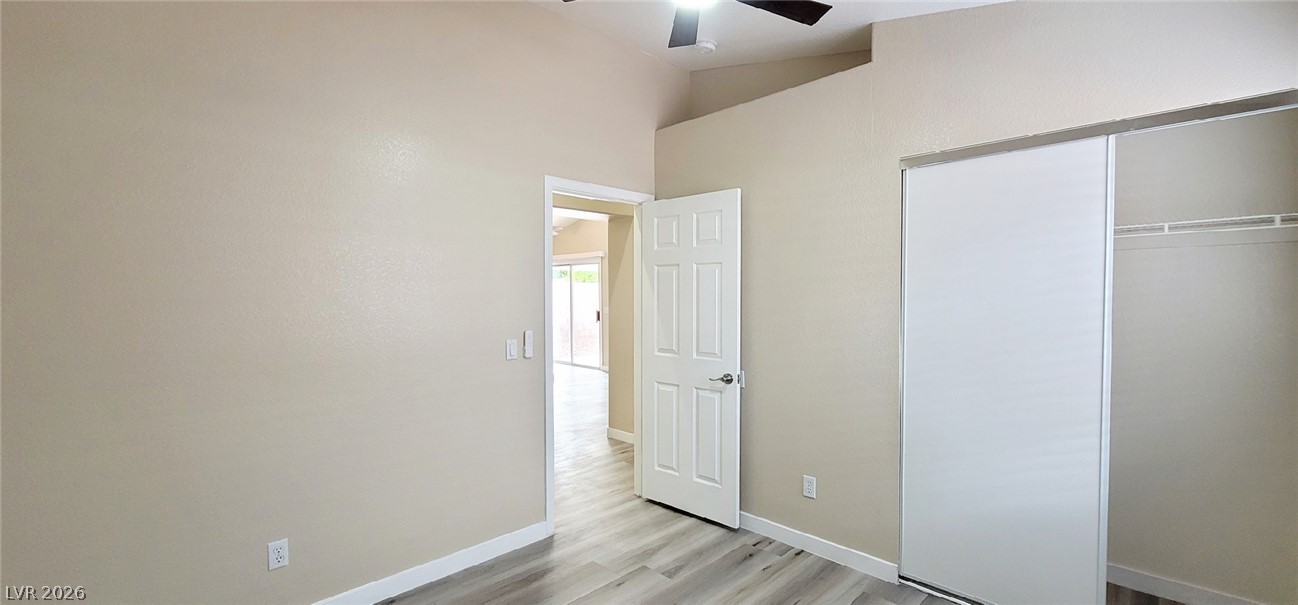 19 Rue De Parc Henderson, NV 89074 - Photo 15 of 23 A vaulted ceiling and wood-style flooring elevate this comfortable bedroom space.