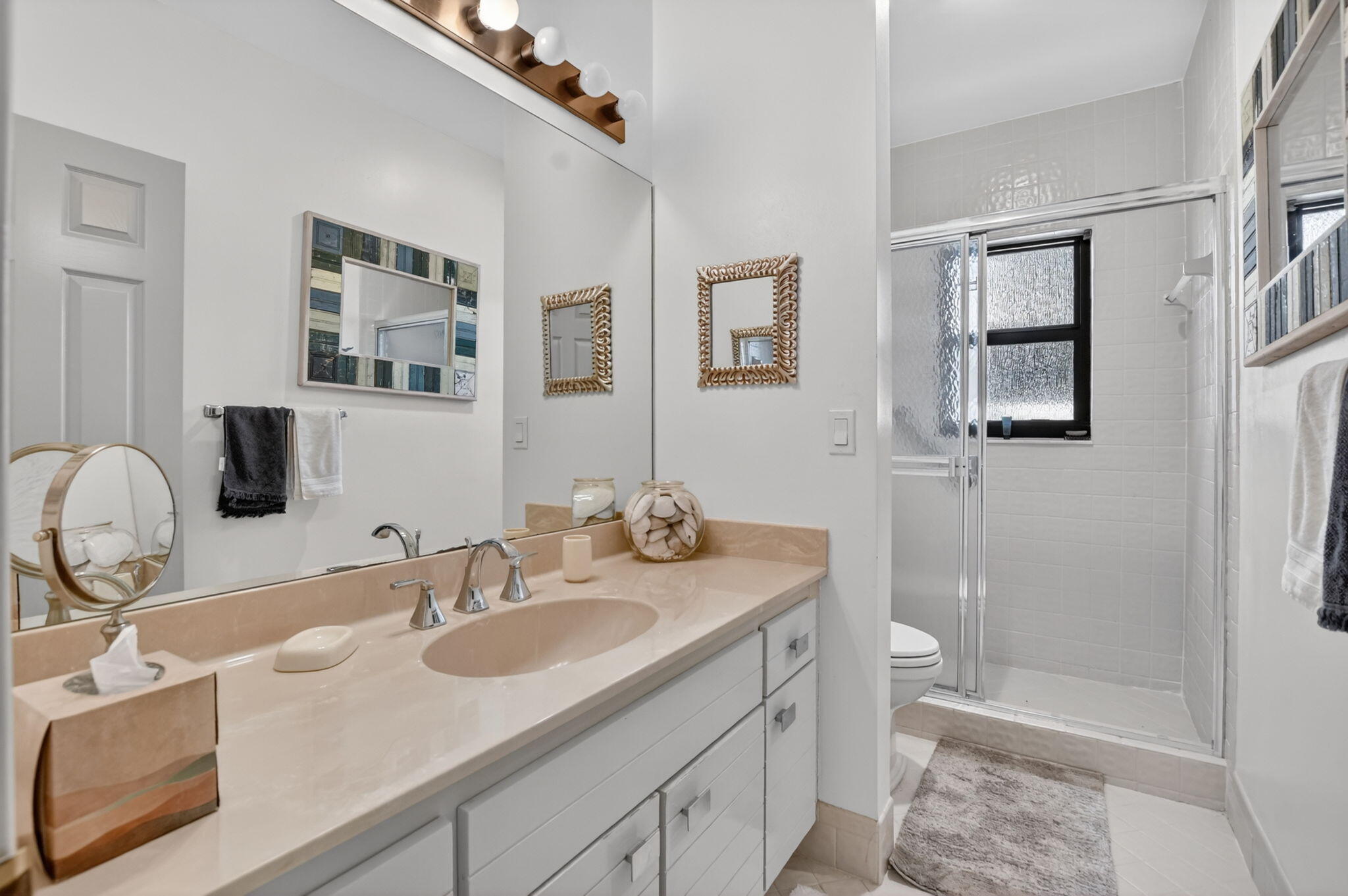 22519 Esplanada Circle, Unit W Boca Raton, FL 33433 - Photo 40 of 57 a bathroom with a sink toilet double vanity and shower