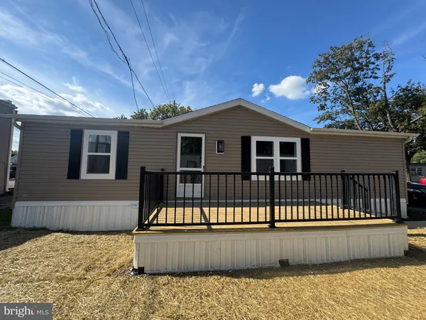 a front view of a house with a wooden fence