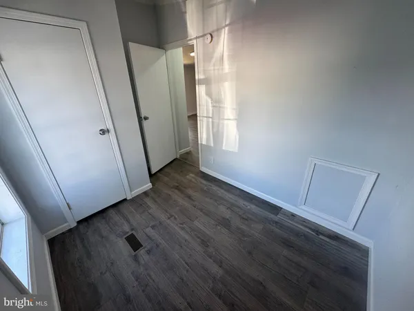 a view of front door and wooden floor
