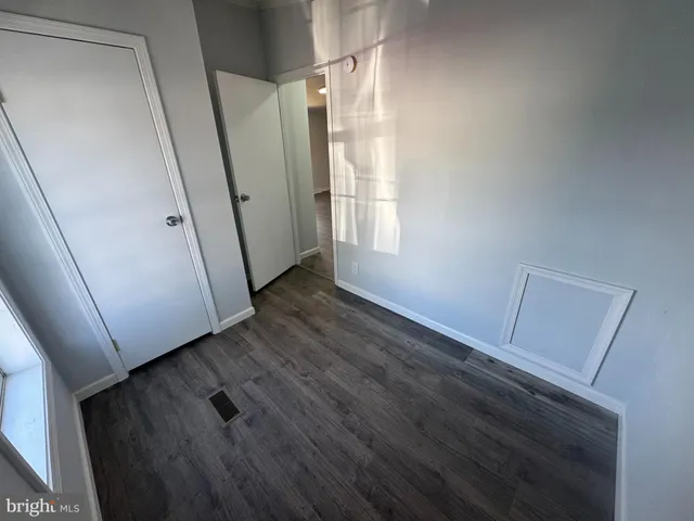 a view of front door and wooden floor