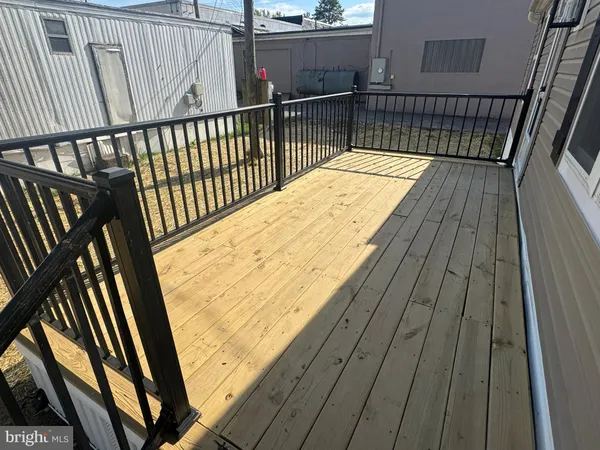 a view of balcony with wooden floor