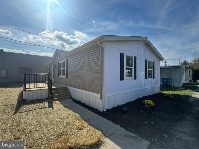 a balcony with table and chairs