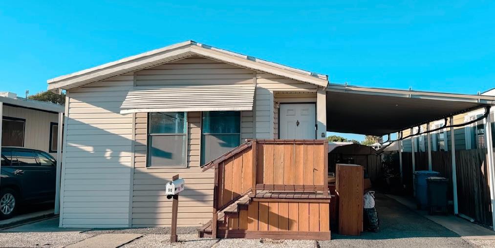 55 Pacifica Avenue, Unit 90 Bay Point, CA 94565 - Photo 1 of 11 a blue and white umbrella sitting in front of a house