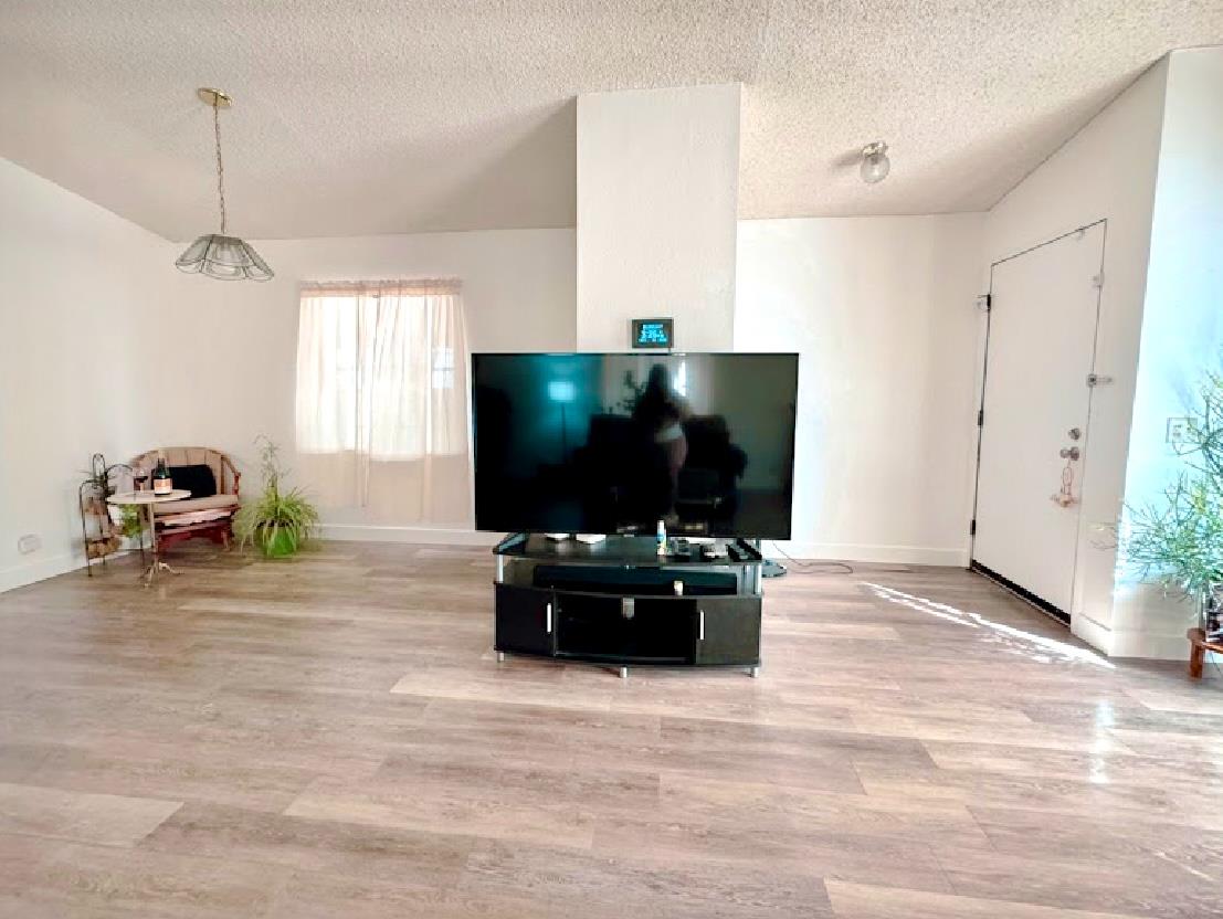 55 Pacifica Avenue, Unit 90 Bay Point, CA 94565 - Photo 5 of 11 a living room with furniture and a flat screen tv