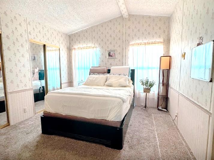 55 Pacifica Avenue, Unit 90 Bay Point, CA 94565 - Photo 8 of 11 a spacious bedroom with a bed and a large window