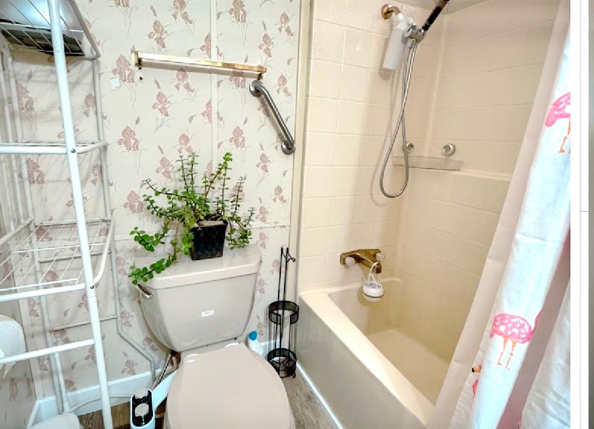 55 Pacifica Avenue, Unit 90 Bay Point, CA 94565 - Photo 10 of 11 a white toilet sitting next to a bath tub and shower