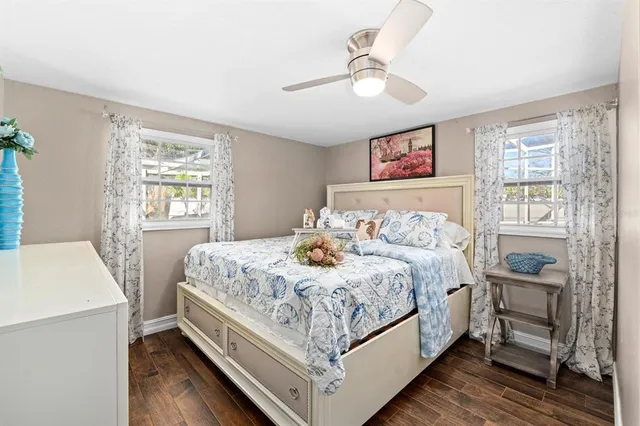 a bedroom with a bed and a table