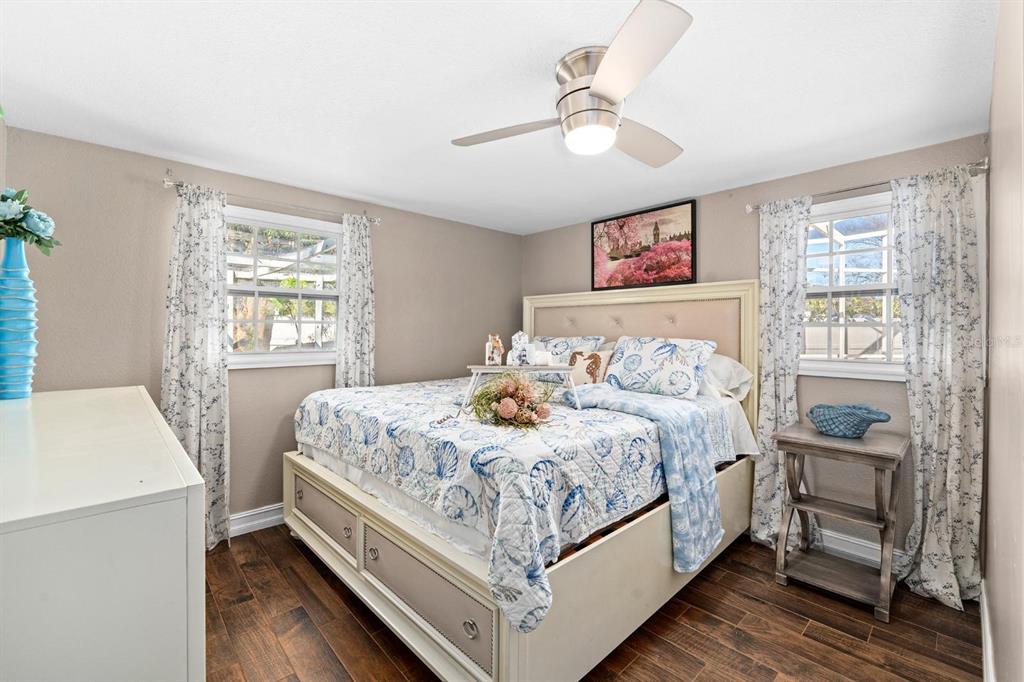 8644 May Circle Tampa, FL 33614 - Photo 12 of 28 a bedroom with a bed and a table