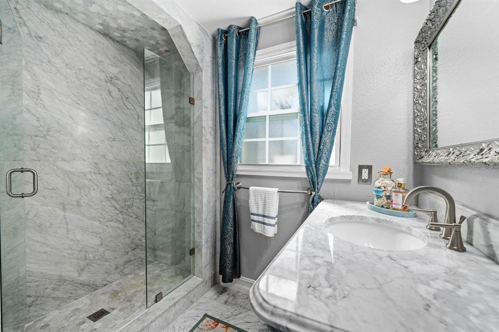 8644 May Circle Tampa, FL 33614 - Photo 14 of 28 a bathroom with a sink and a mirror