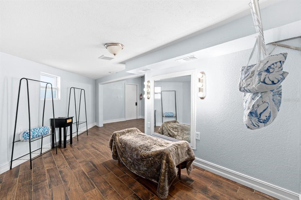 8644 May Circle Tampa, FL 33614 - Photo 15 of 28 a spacious bedroom with a bed and a table in it