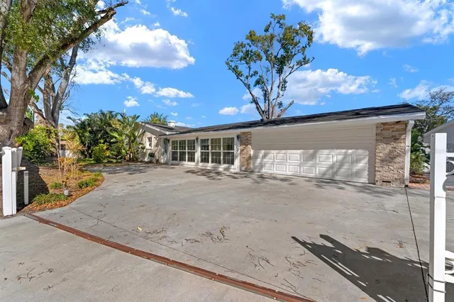 a view of a house with a tree