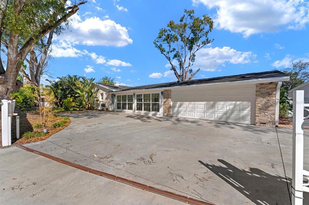 8644 May Circle Tampa, FL 33614 - Photo 21 of 28 a front view of a house with a yard