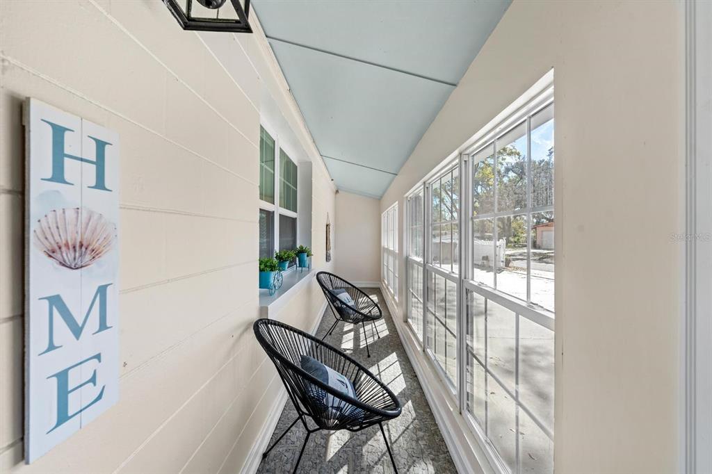 8644 May Circle Tampa, FL 33614 - Photo 27 of 28 a view of entryway with furniture and wooden floor
