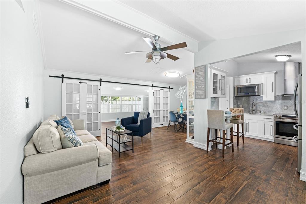 8644 May Circle Tampa, FL 33614 - Photo 3 of 28 a living room with furniture and a large window