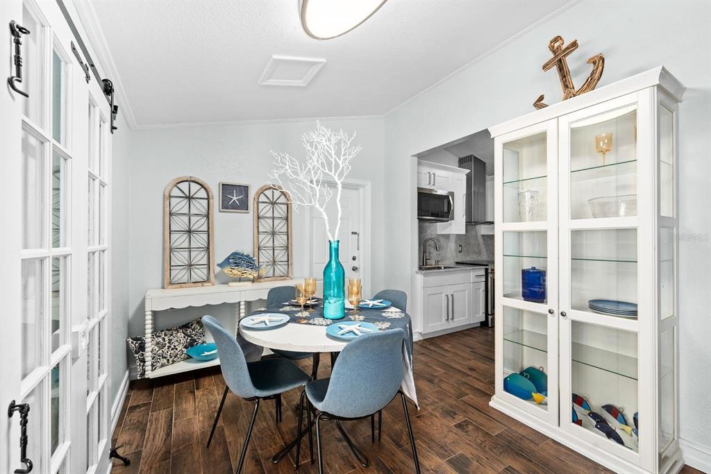 8644 May Circle Tampa, FL 33614 - Photo 5 of 28 a view of a dining room with furniture window and wooden floor