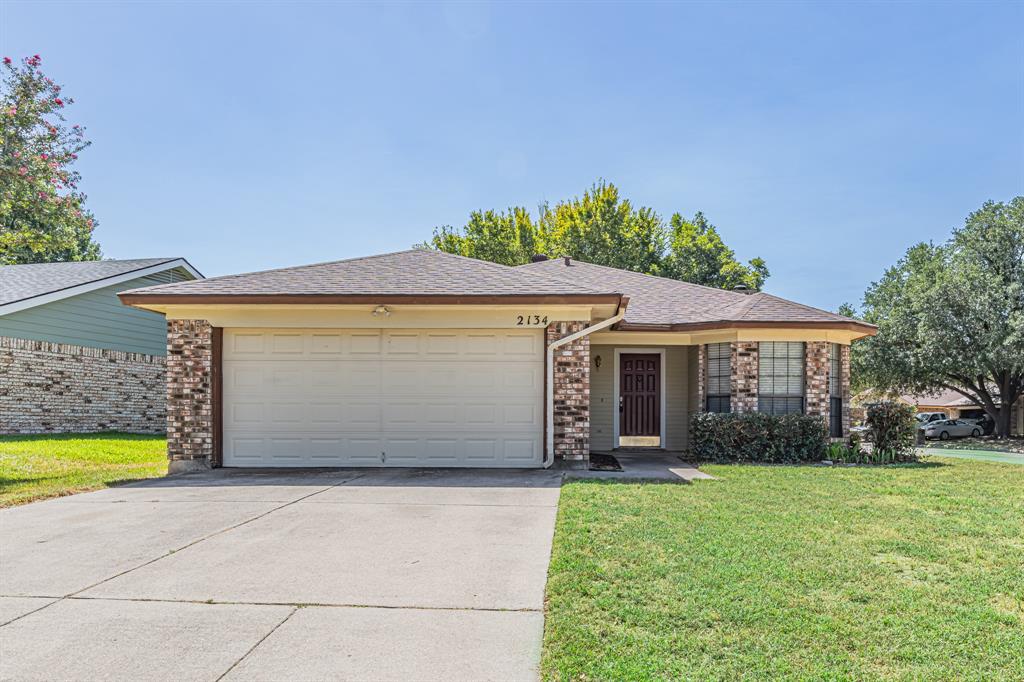 2134 Reverchon Drive Arlington, TX 76017 - Photo 2 of 23 Spacious two car garage. The windows surround the dinning area.