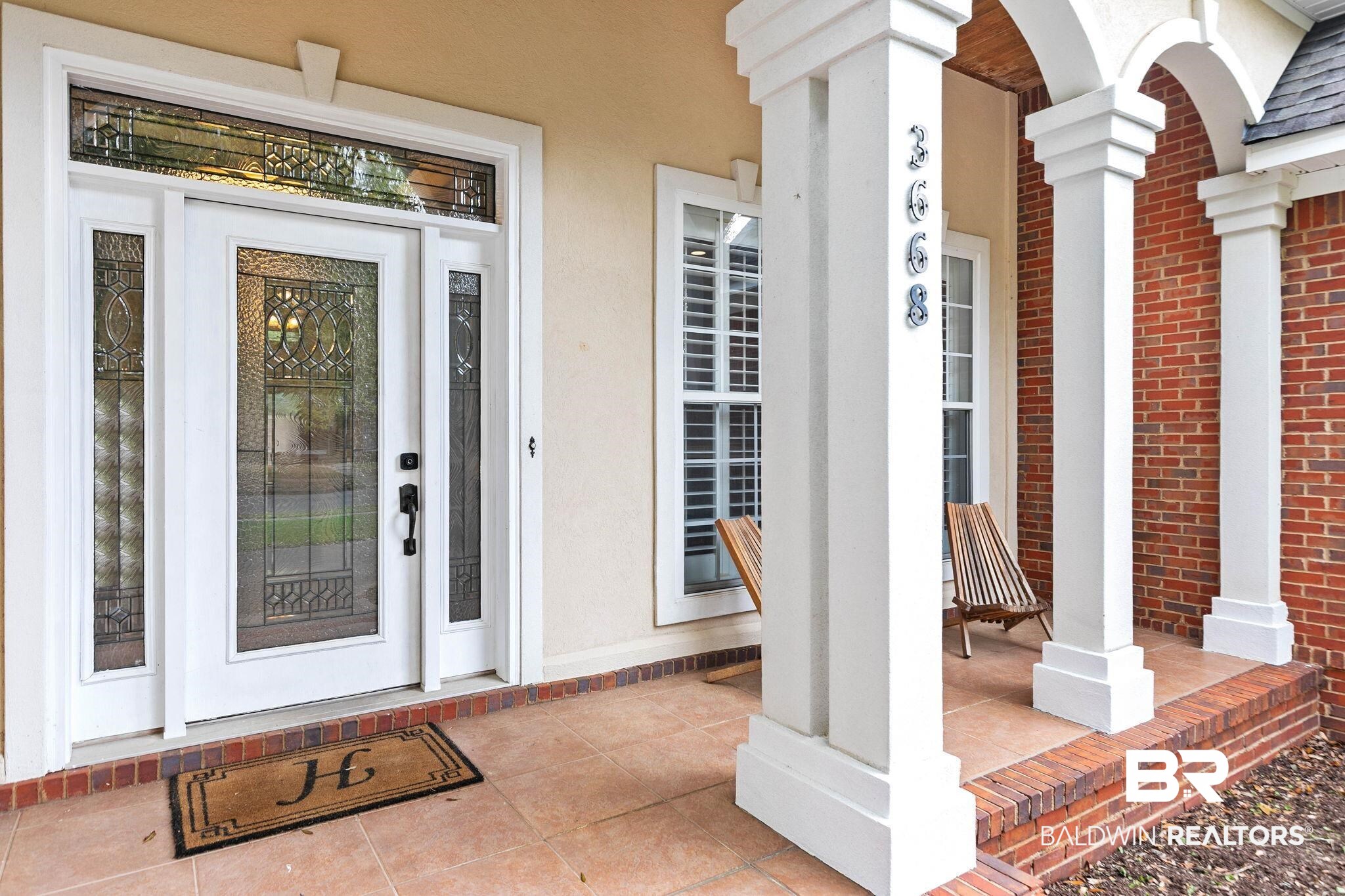 3668 Claridge Road North Mobile, AL 36608 - Photo 17 of 100 View of exterior entry featuring a porch and stucco siding