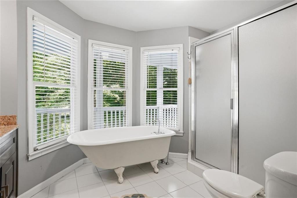 3259 Etchison Road Loganville, GA 30052 - Photo 21 of 50 a bathroom with a sink toilet and shower