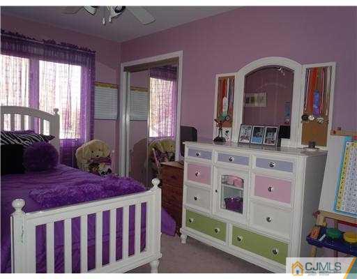 147 Redpine Loop Old Bridge, NJ 08857 - Photo 19 of 25 a bedroom with two beds and a dresser