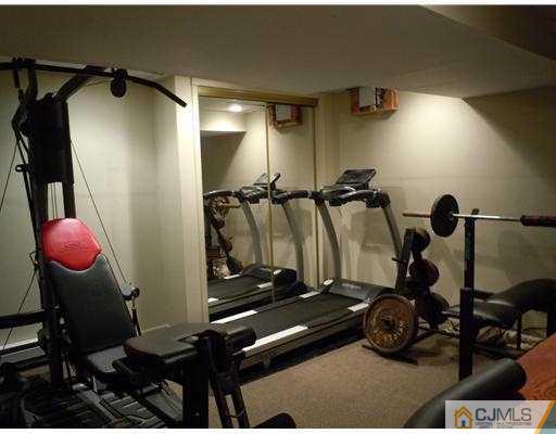 147 Redpine Loop Old Bridge, NJ 08857 - Photo 24 of 25 a room with gym equipment