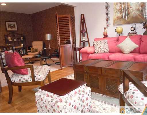 147 Redpine Loop Old Bridge, NJ 08857 - Photo 4 of 25 a bedroom with furniture and a lamp
