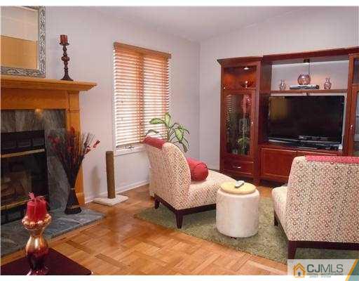 147 Redpine Loop Old Bridge, NJ 08857 - Photo 5 of 25 a living room with furniture and a flat screen tv