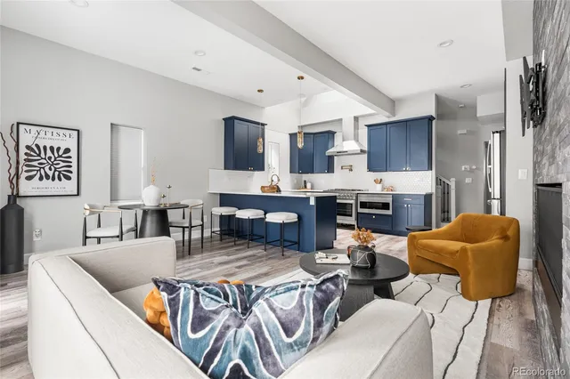a kitchen with a sink a stove and cabinets