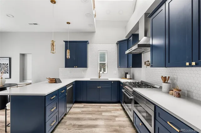 a living room with fireplace furniture and a wooden floor