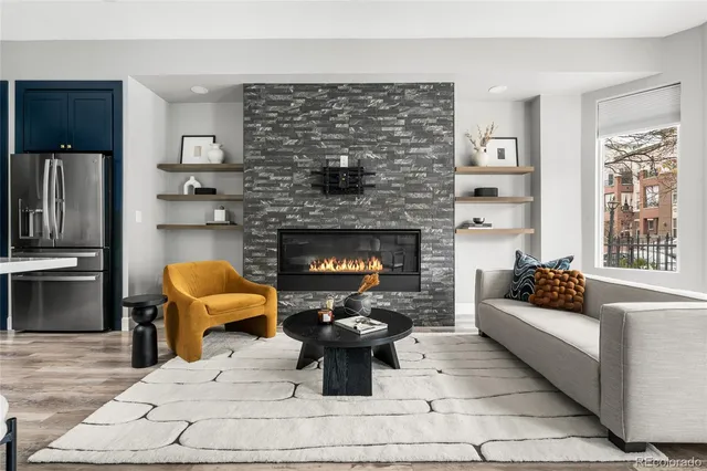 a kitchen with a sink a stove and wooden cabinets