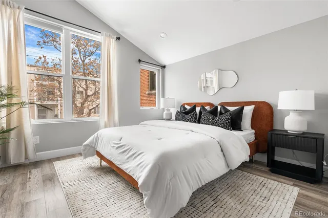 a bathroom with a sink double vanity granite tub shower and a mirror