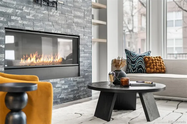 a kitchen with a sink and a stove with wooden floor