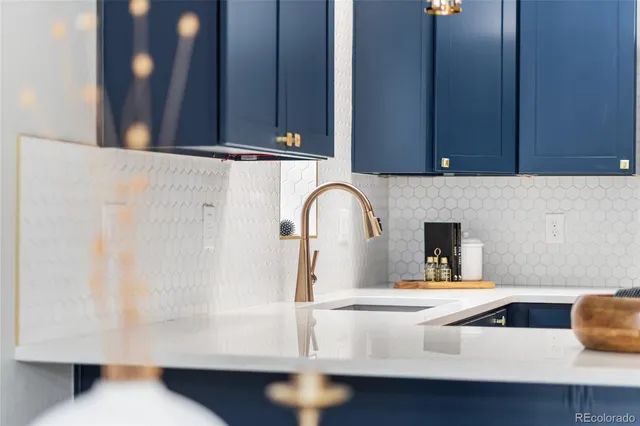 a stove top oven sitting inside of a kitchen