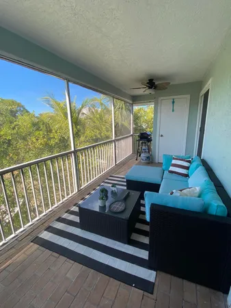 a view of balcony with furniture